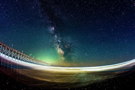 The Milky Way Over Ocean Isle Beach Pier Photograph By Dustin Goodspeed