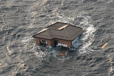 Pictures Of Tsunami Devastation Including A House Floating In The Open