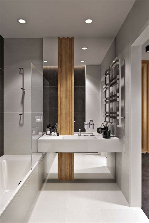 A Modern Bathroom With Two Sinks And A Bathtub In The Center Along