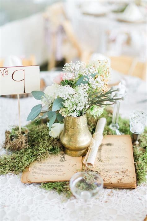 Whimsical Moss And Vintage Book Centerpiece
