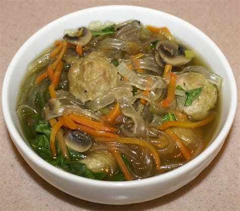 Pork meatballs simmered in chicken broth with cabbage and topped with rice noodles, chili garlic hot sauce, and fresh cilantro. Thai Glass Noodle Soup w/ petite pork meatballs. Authentic ...