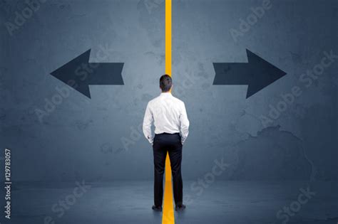 Business Person Choosing Between Two Options Separated By A Yell