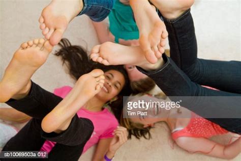 Girls Lying On Floor With Feet In Air Bildbanksbilder Getty Images