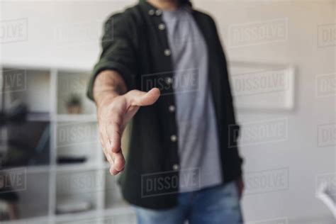 Cropped Shot Of Man Reaching Hand For Handshake While Standing In