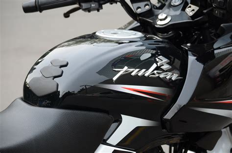 Fuel level indicator shows approx available fuel in fuel tank.( ) symbol blinks continuously when petrol level reaches reserve level. New Bajaj Pulsar 220 photo gallery - Autocar India