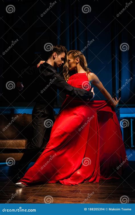 Dance And Love Concept Young Couple In Elegant Evening Dresses Posing In The Room Filled With