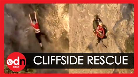 Dramatic Rescue Of Hiker Hanging From Cliffside By Tree Roots Youtube