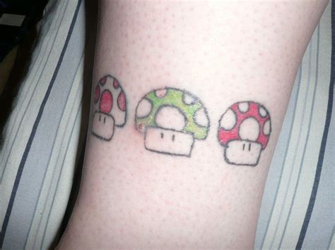 Mario mushroom red ink tattoo on hip. Mario Eating Mushroom Tattoo On Girl Left Foot | Girl ...