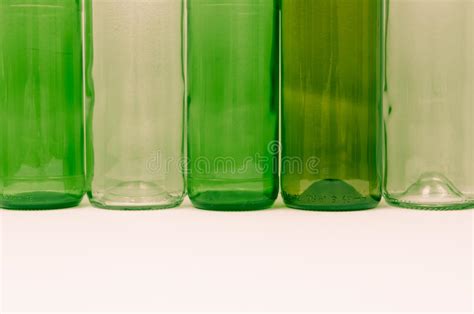 Glass Bottles Of Mixed Colors Including Green Clear White Brow Stock