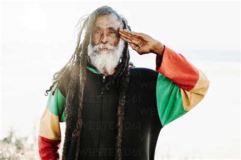 Portrait Of Old Rastafari With Dreadlocks Looking At The Camera In The