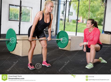 Crossfit Woman Lifts Weights With Personal Trainer Stock Image Image