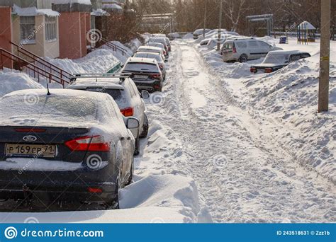 Row Of Snow Drifted Cars In A Row Along The Street Near Residential