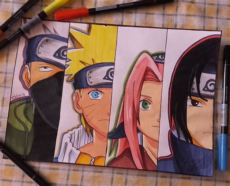 Some Colored Pencils Are Laying On A Table Next To An Image Of Naruto