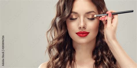 Makeup Artist Applies Eye Shadow Beautiful Woman Face Hand Of