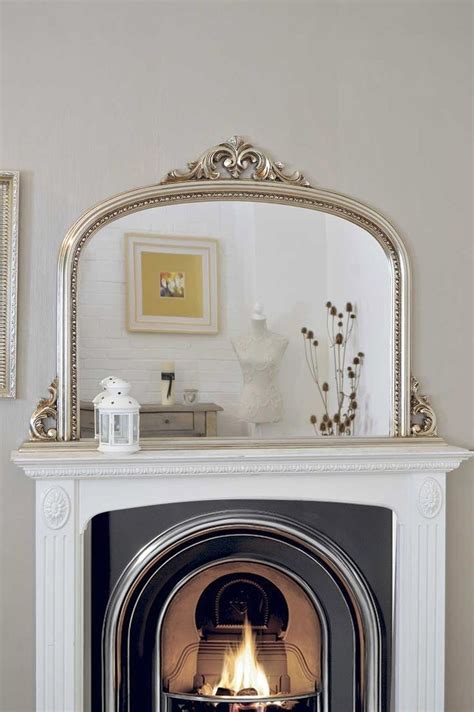 This classic mantel features an arched frieze and can be built using basic carpentry skills. 15 Photos Above Mantel Mirrors | Mirror Ideas