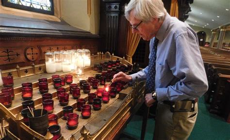 Faithful Uphold The Quiet Tradition Of Lighting Candles In Churches