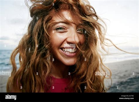Wind Blowing Hair Of Caucasian Woman On Beach Stock Photo Alamy