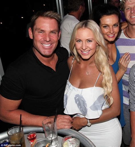 Shane Warne Cuddles Up To Buxom Blonde Model During Night Out With