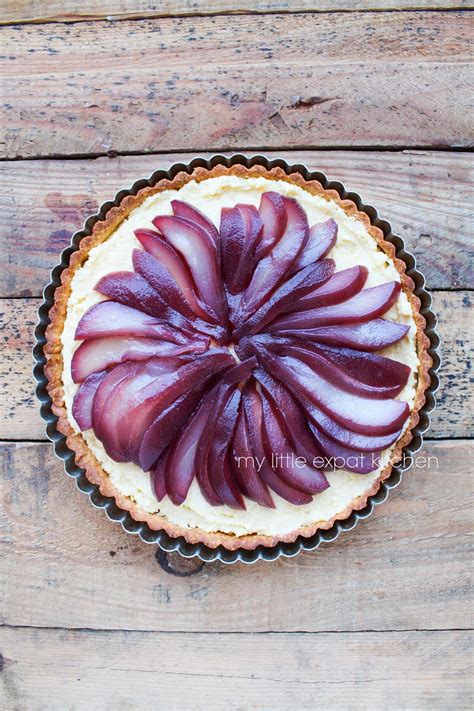 my little expat kitchen spiced red wine poached pear and frangipane tart