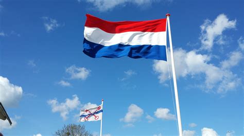 the flag of the kingdom of the netherlands with the flag of the city of leiderdorp in the