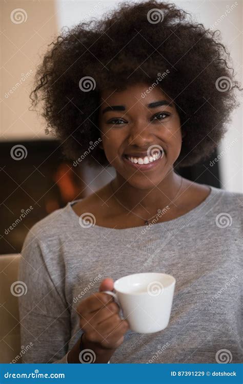 Black Woman Drinking Coffee In Front Of Fireplace Stock Image Image Of Autumn Female 87391229