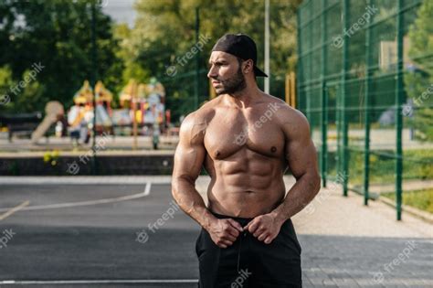 Premium Photo Sexy Fitness Sportsman Posing On A Sports Field Topless Fitness Bodybuilding