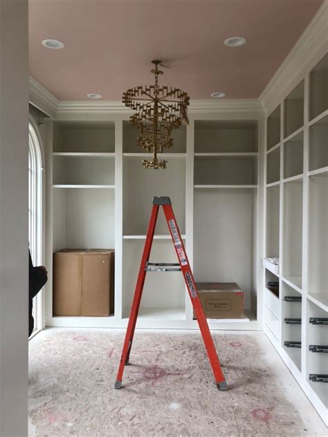 I love to see interiors where bold choices are made and they fit in so wonderfully well. Closet l Ceiling: Pale Petal Cabinetry and Walls: Dove ...