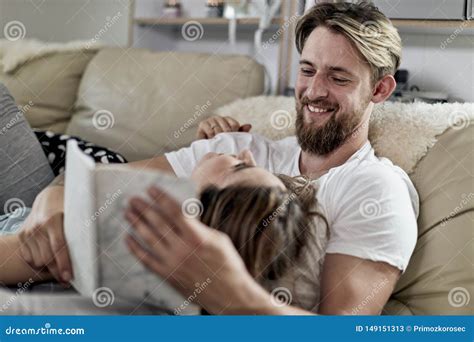 Husband And Wife Relaxing On The Couch Stock Image Image Of Casual Husband 149151313