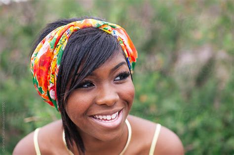 Close Up Of Black Girl Smiling Wearing Head Scarf By Gabrielle Lutze