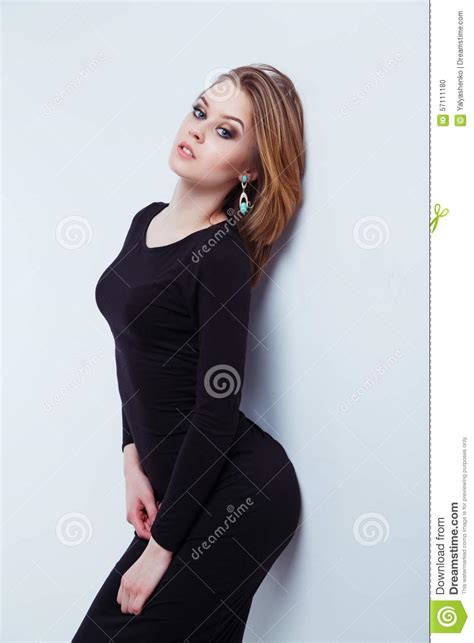 Beautiful Female Fashion Model Posing In Black Dress Stock