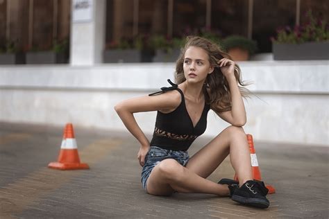 wallpaper tanned sitting women outdoors shoes jean shorts on the floor looking away