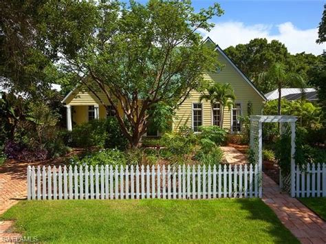 Pretty Little Yellow Beach Cottage In Olde Naples Florida White