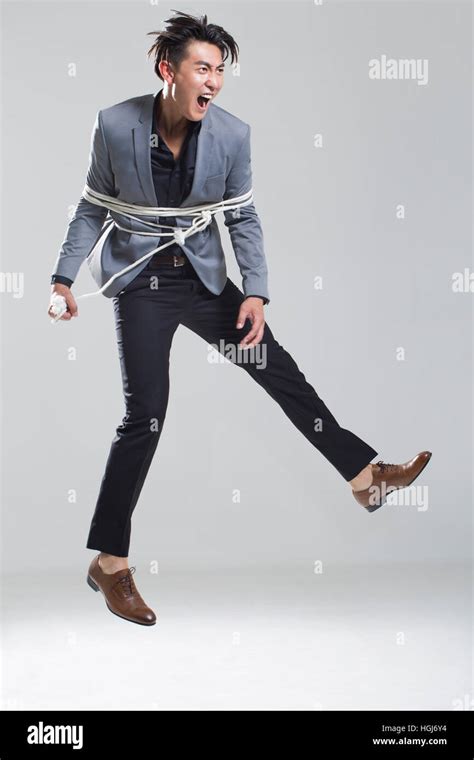 Young Man Tied Up With Rope Stock Photo Alamy