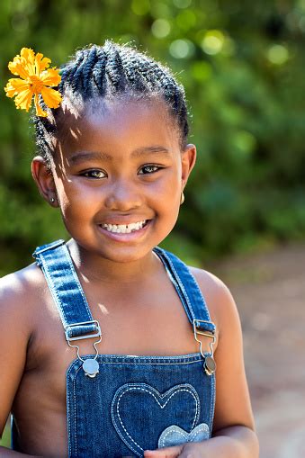 Cute African Girl With Flower In Hair Stock Photo Download Image Now