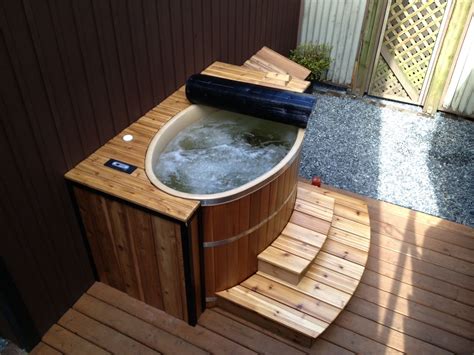 A Small Oval Cedar Hot Tub Finished Off With Some Cedar Decking Our