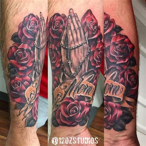 Beautiful Praying Hands With Rosary Roses And Mom Banner Tattoo By