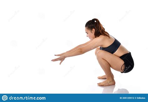 Woman Gets Up After Squatting Studio Shot On White Stock Photo Image
