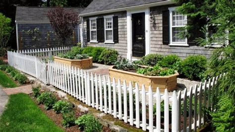 White Picket Fence Around Raised Garden Beds In Front Of House Wood