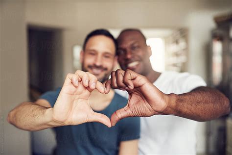 Black And White Couple Gesturing Heart With Hands By Flamingo Images Couple Gay Stocksy United