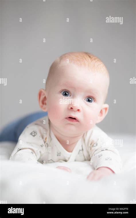 Cute Baby Boy With A Surprised Expression Stock Photo Alamy