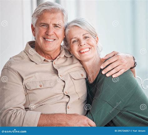 Happy Senior Caucasian Couple Bonding At Home Smiling And Affectionate