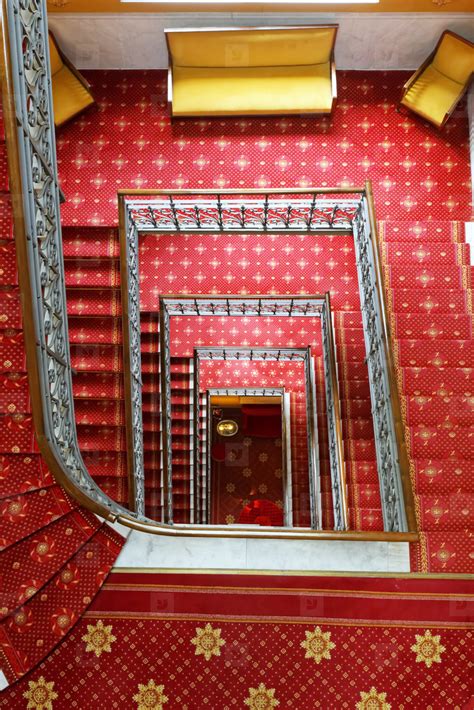 Try us, as we will not let you down. Photos - Spiral staircase with red carpet 181225 - YouWorkForThem