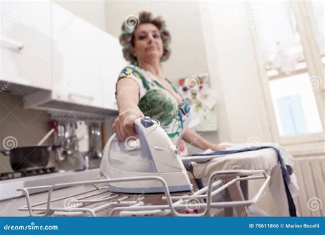Beautiful Mature Woman With Curlers Ironing Stock Photo Image Of