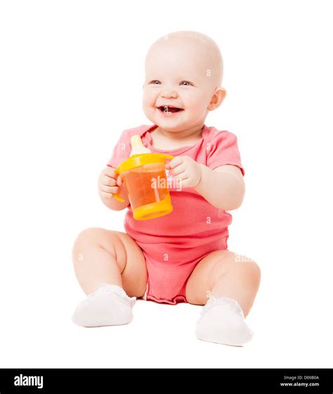 Baby Drinking Juice Isolated Against White Background Stock Photo Alamy