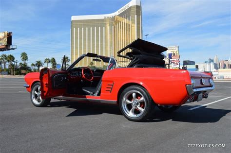 Located on las vegas boulevard, just 10 minutes from the famous welcome to las vegas sign. convertible mustang sports car with top going down outside ...