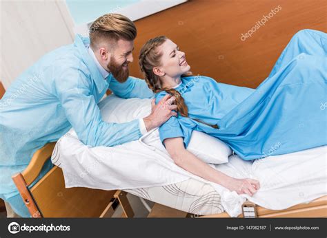 Pregnant Woman Giving Birth Stock Photo By Andreybezuglov