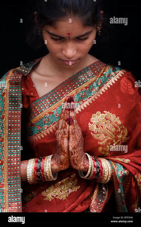 Indian Girl Wearing Traditional Silk Sari With Henna Prayer Hands Stock