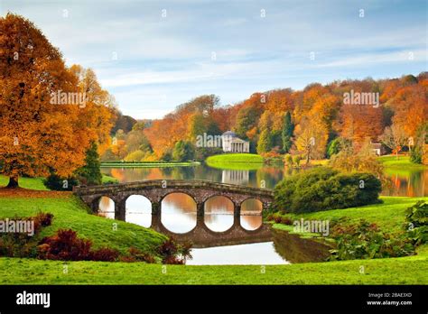 Brilliant Autumn Colour Surrounds The Lake And Palladian Bridge In
