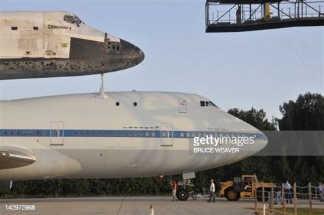 The Us Space Shuttle Discovery Sits Atop Nasas 747 Shuttle Carrier