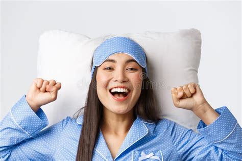 Close Up Of Enthusiastic Asian Girl In Blue Pajamas And Sleeping Mask